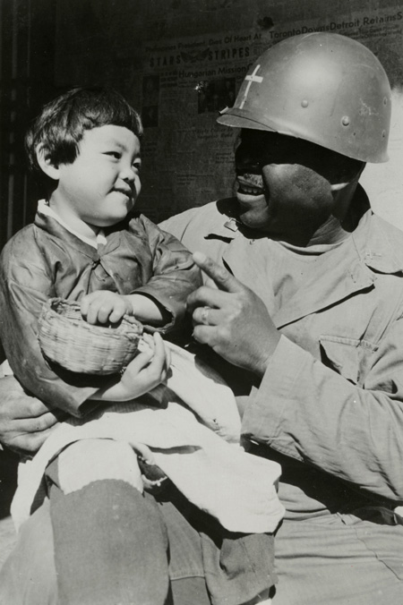 Korean War Chaplain with Korean child