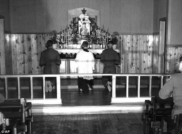 Chaplain (CPT) Emil Kapaun (center) celebrates Mass at Herrington Army Air Base, 1942.